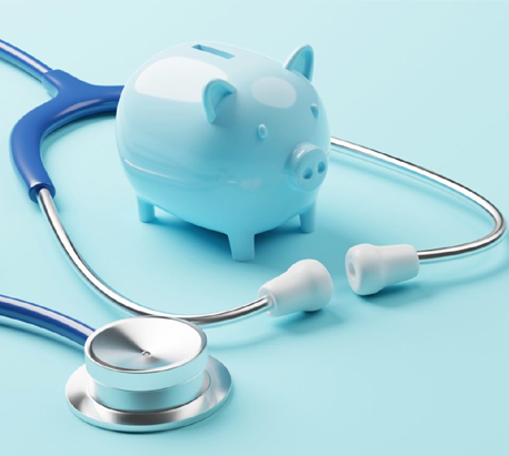 A stethoscope and piggy bank on top of a table.